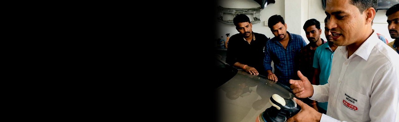 Instructor demonstrating professional polishing techniques
