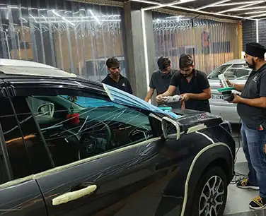 Students practising inside the professional detailing studio